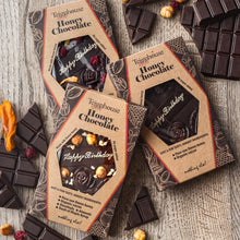 Artisan handmade chocolate bar, honey chocolate, dark, raw, with organic cacao, decorated with dried fruit, no added sugar, only natural ingredients