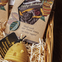 Happy birthday gift basket containing Teignhouse honey chocolate, Stones honey, lip balm, candle  and raw Devon honey