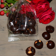 Dark chocolate sweets made with honey, hazelnuts and prunes