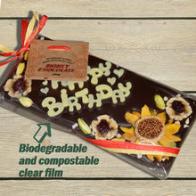 Artisan handmade chocolate bar, honey chocolate, dark, raw, with organic cacao, decorated with dried fruit, no added sugar, compostable packaging